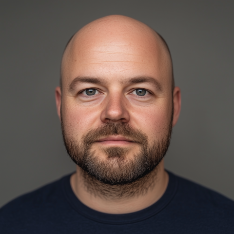 Bald Man with Beard in Neutral Portrait