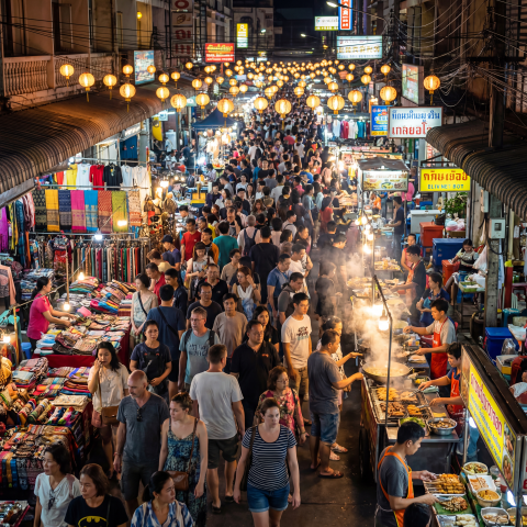 Bustling Night Market with Vibrant Stalls and Diverse Crowds