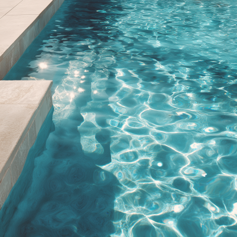 Modern Swimming Pool with Sunlit Ripples